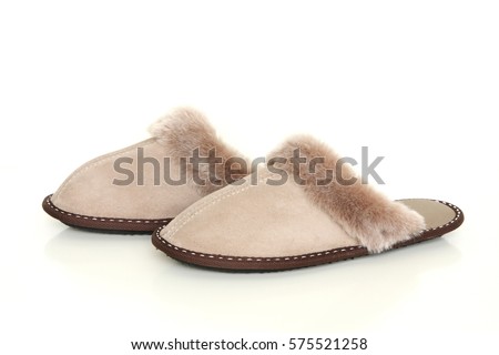 Sheepskin slippers isolated on white background