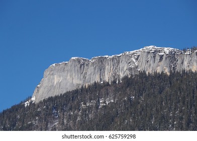 Sheer Rock Wall Rising Up From The Forest