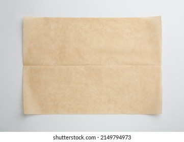 Sheet Of Brown Baking Paper On White Background, Top View