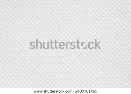 A sheet of clean tiled white tissue paper as background