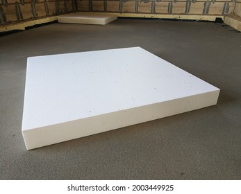 Sheet of expanded polystyrene on the concrete floor for house thermal insulation during constructions