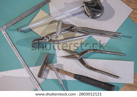 Sheet metal working tools, tin snips hammer tape measure and carpenter square