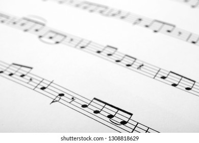 Sheet with music notes as background, closeup