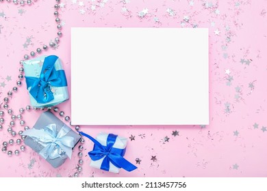 Sheet of paper, beautiful confetti and gifts on pink background - Powered by Shutterstock