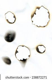 Sheet of paper with the burnt holes. Burn marks.  High resolution scanned image  - Shutterstock ID 238872271
