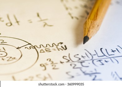 Sheet Of Paper Filled With Calculations Of Nuclear And Quantum Physics As A Background