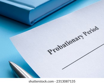 A sheet of paper with the inscription probationary period lies on the table.