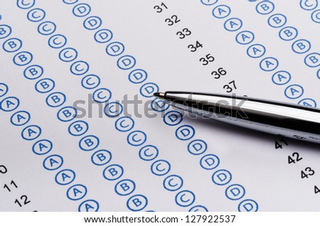 Sheet of standardized test and pen