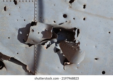 Sheet Of Steel Pierced By An Artillery Shell.