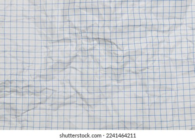 Sheet of white squared paper from a notebook, crumpled