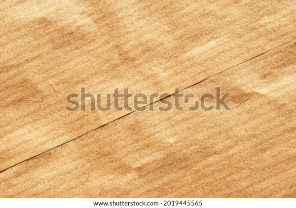 A sheet\
of wrinkled food kraft  paper as\
background