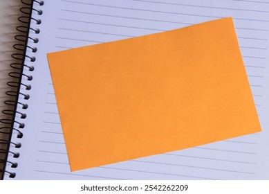 Sheet of yellow post note paper or self-adhesive notes with background notebook. Message Pad. Sticky Pad. love you message. words written on sticky notes. Work. Call Me. 