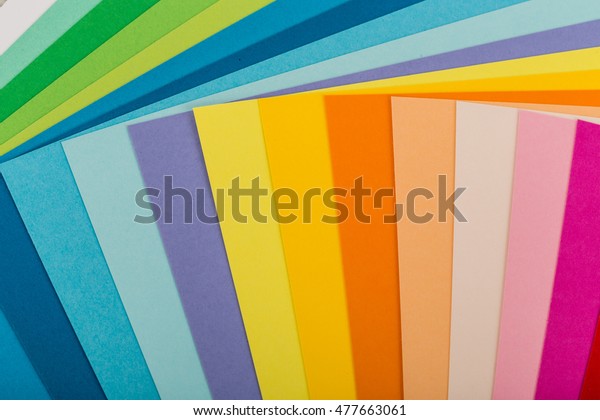 Sheets of colored paper, iridescent palette of\
colored paper, rainbow\
colors