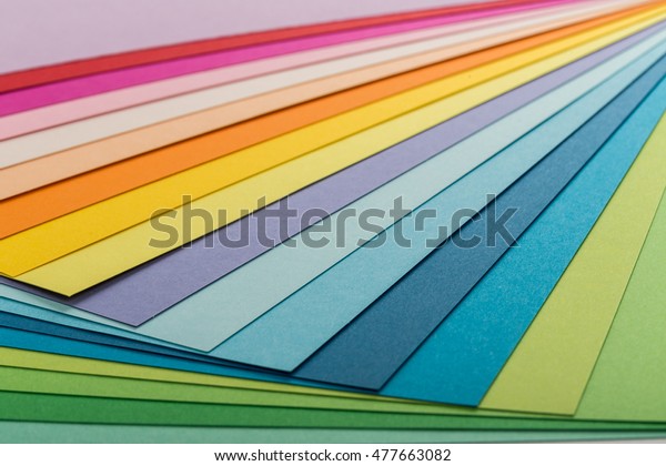 Sheets of colored paper, iridescent palette of\
colored paper, rainbow\
colors