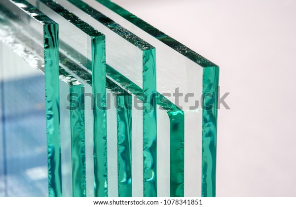 Sheets of Factory manufacturing tempered clear float\
glass panels cut to size