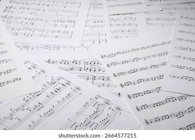 Sheets with musical notes as background, closeup