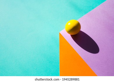 Sheets Of Paper Create Illusion Of Three-dimensional Cube. Ball With Hard Shadow. Geometric Background In In Bright Colors