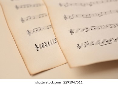 Sheets of paper with different notes on beige background, closeup