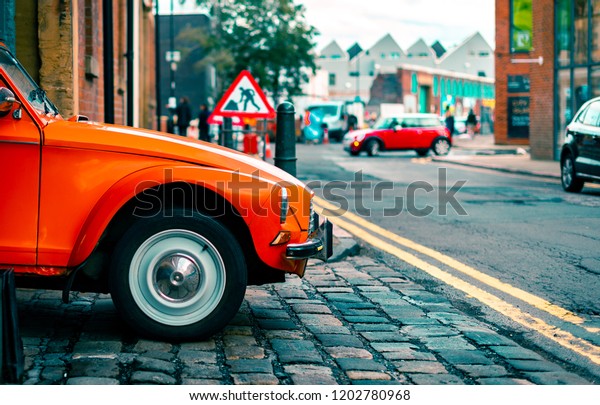 Sheffield,\
England - 13th October, 2018: A Citroën Dyane leaves a parking\
garage driven by an old woman in Sheffield,\
UK