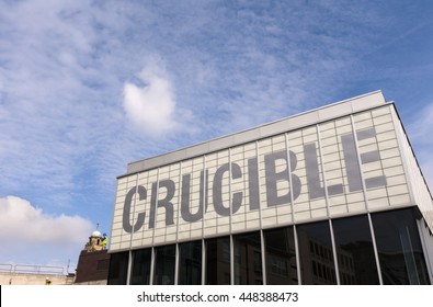 Sheffield, South Yorkshire, England: 11 April 2011 - Sheffield's Crucible Theatre on a fine spring day. Workmen can be seen on nearby rooftops.