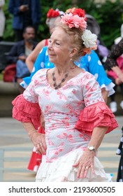 Sheffield, South Yorkshire, UK
July 2  2022
Flamenco Dancers In Sheffield Display Their Skills In This Annual Street Festival Of Dance. An Older Lady Is In The Foreground.