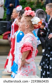 Sheffield, South Yorkshire, UK
July 2  2022
Flamenco Dancers In Sheffield Display Their Skills In This Annual Street Festival Of Dance. An Older Lady Is In The Foreground.