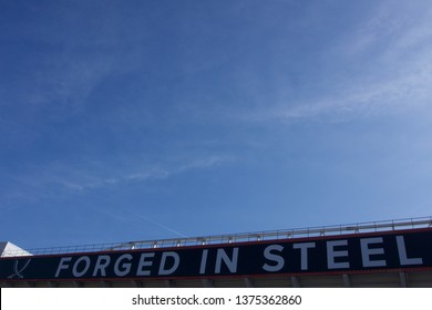 Sheffield / UK - April 20, 2019: Sheffield United Football Club, Bramall Lane 'Forged In Steel' Logo On Stadium Exterior