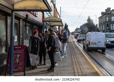 Sheffield, UK - Dec. 09, 2021: Young People Chatting And Waiting At The Langsett Rd Bus Stop In The Hillsborough Area