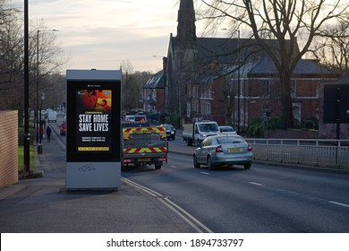 Sheffield, United Kingdom, 12th January, 2021: Close Up Of Coronavirus Guidance Bill Board At The Side Of Busy Upper Hanover Street. Cars Drive By