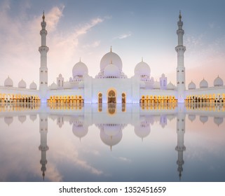 Sheikh Zayed Grand Mosque In Abu Dhabi During Pink Sunset. View Of Floral Pattern On The Floor Of Mosque.