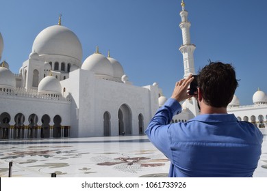 Sheikh Zayed Mosque - A Man Taking Picture Of The Building With His Mobile Phone. 