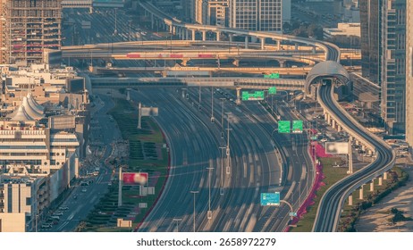 Sheikh Zayed Road at intersection of Hessa Street aerial timelapse from above before sunset, Dubai, United Arab Emirates. Sheikh Zayed Road is the main highway running through Dubai.