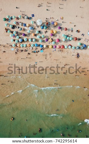 Similar – Luftaufnahme von fliegenden Drohnen von Menschen, die sich am Algarve Beach in Portugal entspannen.