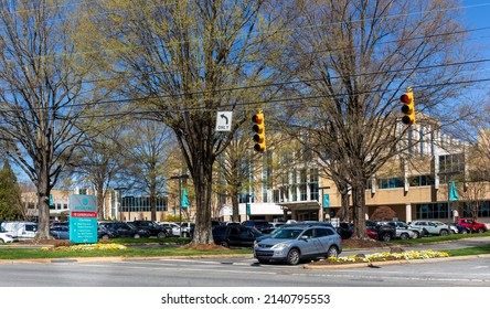 SHELBY, NC, USA-28 MARCH 2022: Entrance To Atrium Health Hospital, Showing Building, Parking Lot, And Directional Monument Sign At Street.