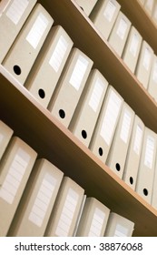 A shelf and a lot of catalogs filled with documents
