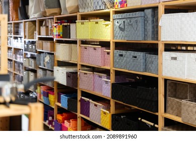 Shelf With Colored Storage Baskets For Sell In A Household Goods Store