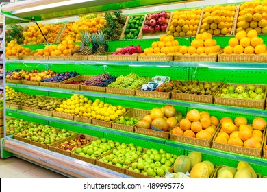 Shelf With Fresh Organic Fruits On A Farm Market Supermarket. Apple, Orange, Grapes, Persimmon, Kiwi, Pineapple, Pear, Plum, Prunes, Melon, Watermelon, Exotic Fruit. Fruits, Fruits, Fruits, Fruits.