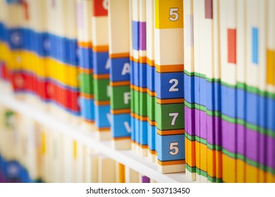 Shelf Of Medical Files In Office Setting.