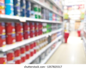 Shelf With Paint Buckets In Hardware Store Blurred Background