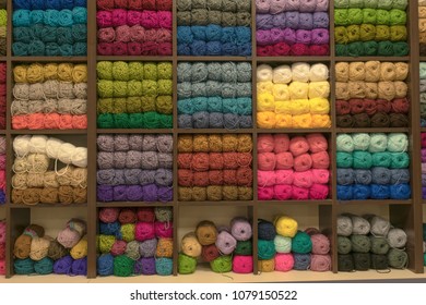 Shelf in store and wool balls different colors 