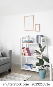 Shelf unit with books in interior of room