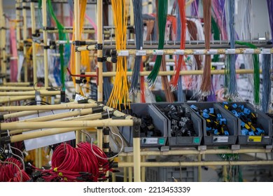 shelf with wires and connectors in a wire harness factory