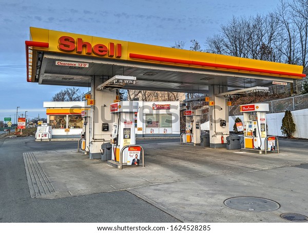 Shell gas service\
station, Dunkin Donuts coffee shop, Revere Massachusetts USA,\
December 25, 2019