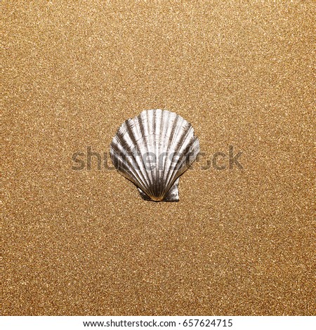 Shell on a gold background. Minimal art