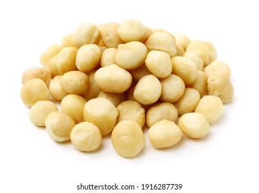Shelled and unshelled macadamia nuts on white background 