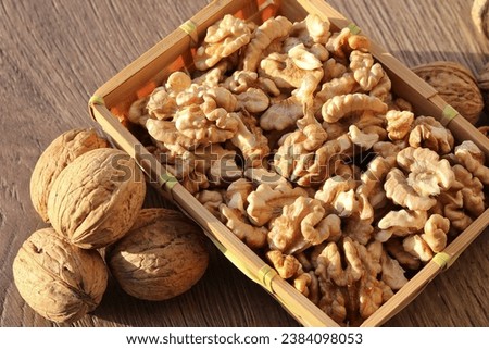 Shelled walnut kernels in a small basket