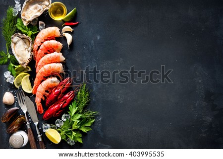 Shellfish plate of crustacean seafood with shrimps, mussels, oysters as an ocean gourmet dinner background
