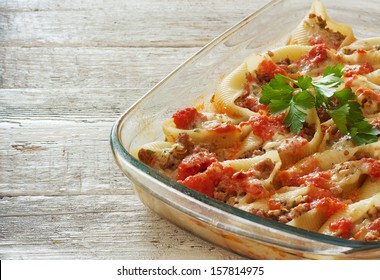 Shells pasta stuffed with mincemeat and cheese