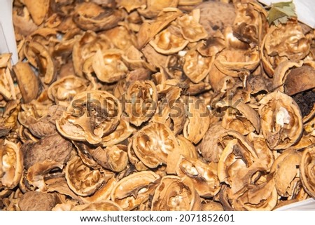 Shells from  peeled walnuts. Texture of the empty broken walnut shells