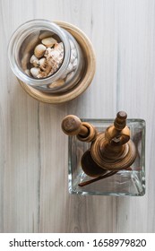 Shells and turned wood objects into glass and wood containers